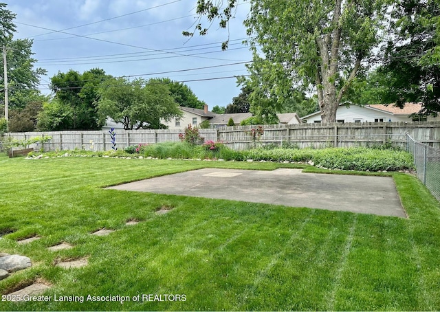 4624 Meaford St, Lansing, MI 48917 - fenced backyard featuring a patio area