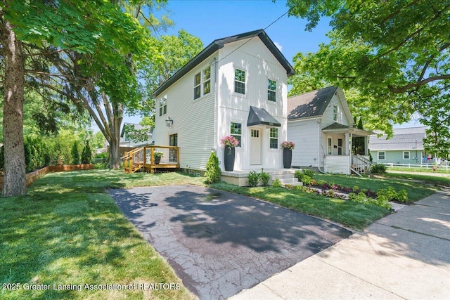 1033 May St, Lansing, MI 48906 - view of front of home with a front lawn
