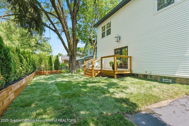 1033 May St, Lansing, MI 48906 - view of green lawn featuring a deck