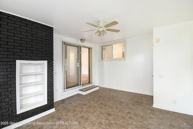 3739 Ridgefield Rd, Lansing, MI 48906 - spare room featuring built in features and ceiling fan