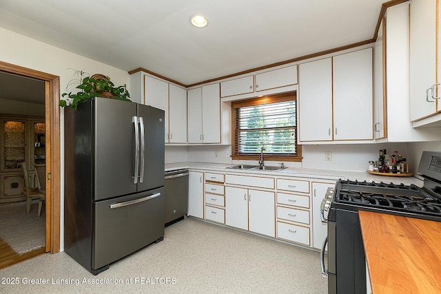 943 Lantern Hill Dr, East Lansing, MI 48823 - kitchen featuring stainless steel appliances, white cabinets, recessed lighting, and butcher block counters