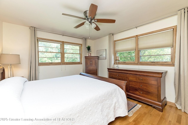 943 Lantern Hill Dr, East Lansing, MI 48823 - bedroom featuring light wood-style floors and a ceiling fan