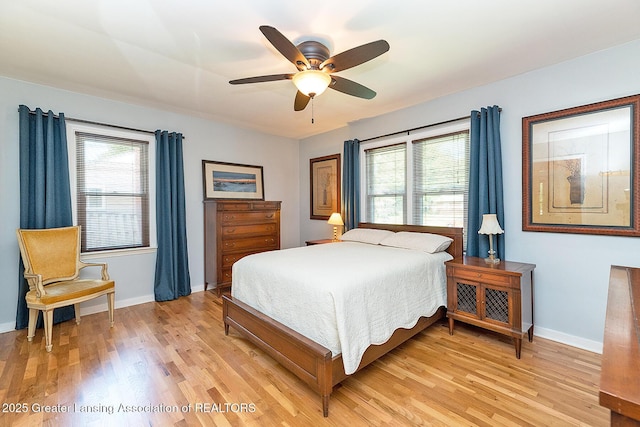 943 Lantern Hill Dr, East Lansing, MI 48823 - bedroom featuring multiple windows, light wood-style flooring, and a ceiling fan