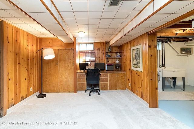 943 Lantern Hill Dr, East Lansing, MI 48823 - office area with wood walls, washer / clothes dryer, and light carpet