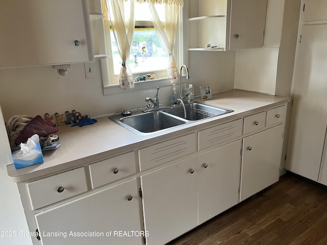 500 N Catherine St, Lansing, MI 48917 - kitchen with open shelves, white cabinets, dark wood-type flooring, and light countertops