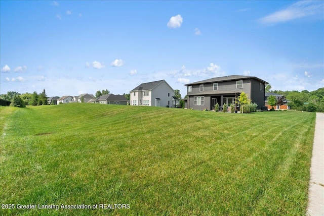 6102 Sleepy Hollow Ln, East Lansing, MI 48823 - view of green lawn featuring a residential view