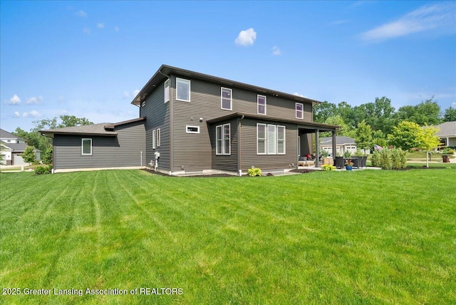 6102 Sleepy Hollow Ln, East Lansing, MI 48823 - rear view of property with a yard