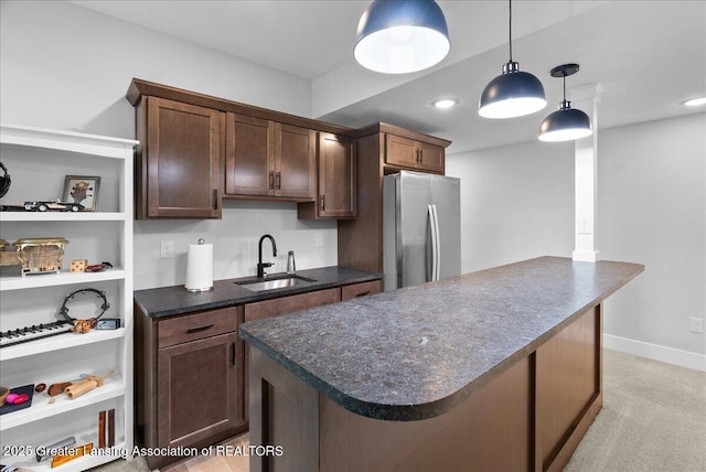 6102 Sleepy Hollow Ln, East Lansing, MI 48823 - kitchen featuring freestanding refrigerator, dark countertops, dark brown cabinets, hanging light fixtures, and recessed lighting