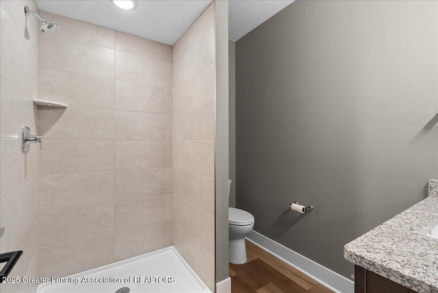 6102 Sleepy Hollow Ln, East Lansing, MI 48823 - full bath featuring wood finished floors, vanity, and tiled shower