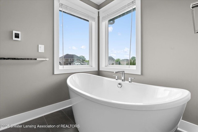 6102 Sleepy Hollow Ln, East Lansing, MI 48823 - full bathroom with a soaking tub and tile patterned floors
