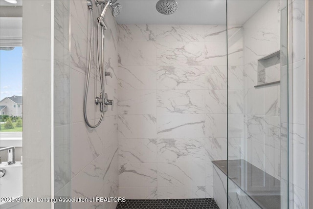 6102 Sleepy Hollow Ln, East Lansing, MI 48823 - bathroom featuring a tile shower and healthy amount of natural light