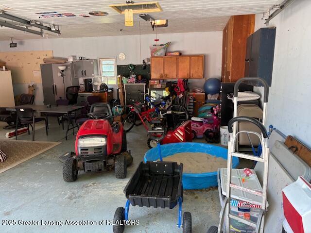 6321 Marywood Ave, Lansing, MI 48911 - garage with electric panel and a garage door opener