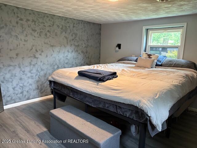6321 Marywood Ave, Lansing, MI 48911 - bedroom with wood finished floors and baseboards