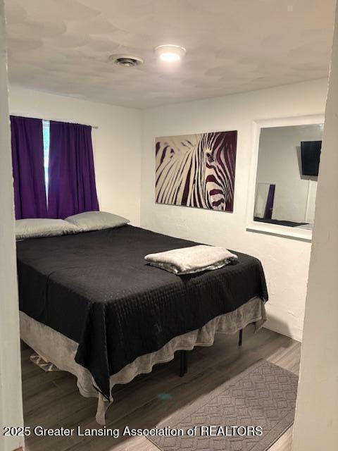 6321 Marywood Ave, Lansing, MI 48911 - bedroom featuring wood finished floors