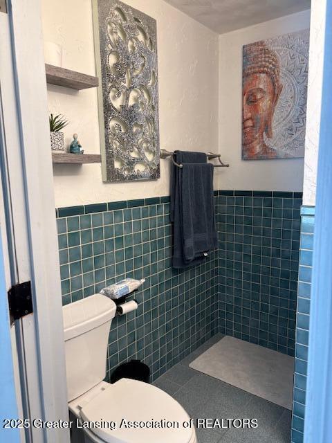 6321 Marywood Ave, Lansing, MI 48911 - bathroom featuring tile walls and wainscoting