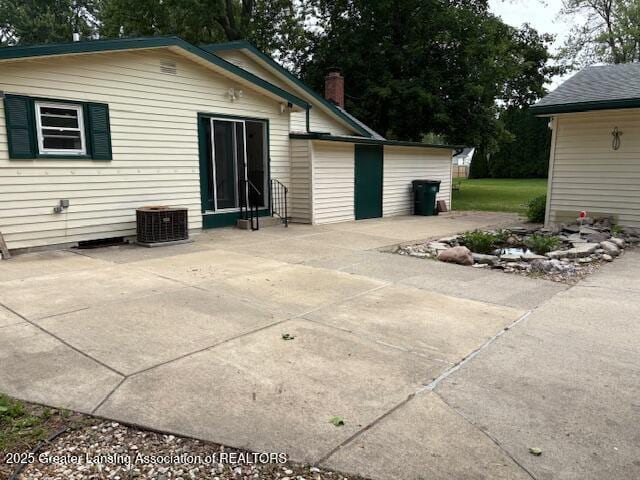 6321 Marywood Ave, Lansing, MI 48911 - back of property featuring a patio area