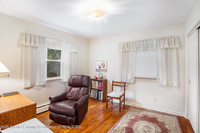 2782 Roseland Ave, East Lansing, MI 48823 - sitting room with a baseboard radiator and wood finished floors