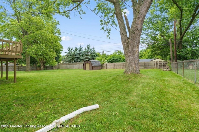 4733 S Pennsylvania Ave, Lansing, MI 48910 - fenced backyard with a storage shed and a deck