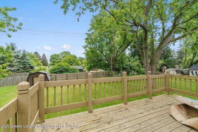4733 S Pennsylvania Ave, Lansing, MI 48910 - wooden terrace featuring a shed and a fenced backyard