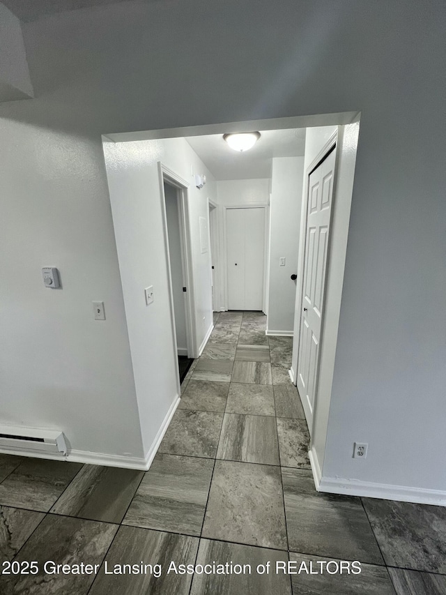 4733 S Pennsylvania Ave, Lansing, MI 48910 - hallway featuring baseboards and marble finish flooring