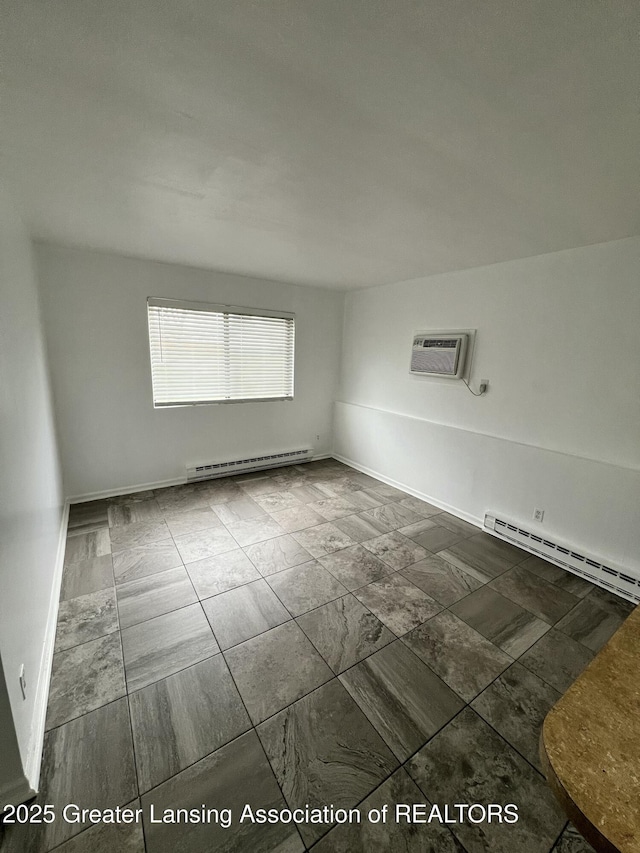 4733 S Pennsylvania Ave, Lansing, MI 48910 - unfurnished room with a baseboard radiator and a wall mounted AC