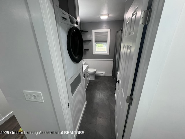 4733 S Pennsylvania Ave, Lansing, MI 48910 - bathroom with a wainscoted wall, vanity, curtained shower, and a baseboard heating unit