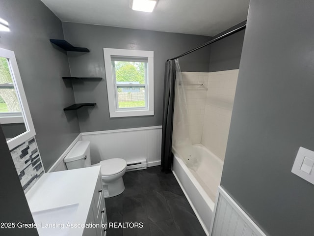 4733 S Pennsylvania Ave, Lansing, MI 48910 - bathroom featuring baseboard heating, wainscoting, vanity, and shower / bath combo