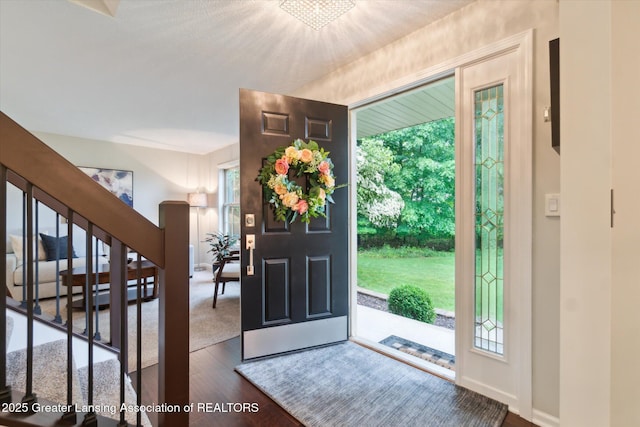 3901 W Howe Rd, Dewitt, MI 48820 - entryway featuring dark wood-type flooring and stairway