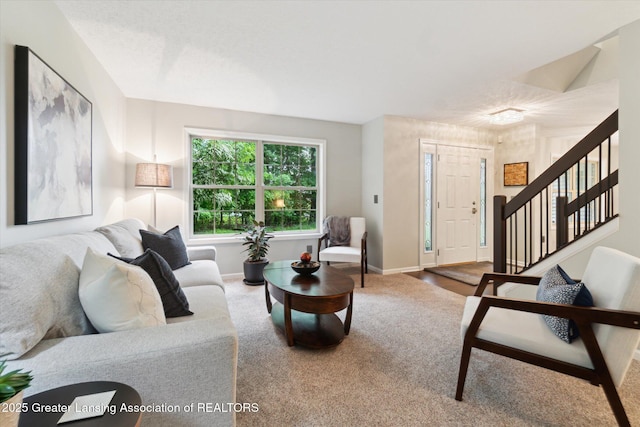 3901 W Howe Rd, Dewitt, MI 48820 - carpeted living room featuring stairway and baseboards