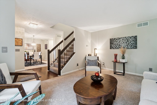 3901 W Howe Rd, Dewitt, MI 48820 - carpeted living room featuring stairs and baseboards