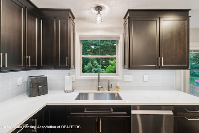 3901 W Howe Rd, Dewitt, MI 48820 - kitchen with dishwasher, tasteful backsplash, dark brown cabinets, and light countertops
