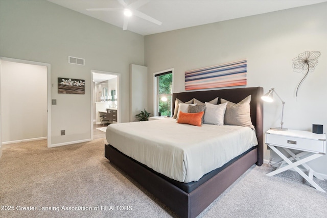 3901 W Howe Rd, Dewitt, MI 48820 - carpeted bedroom featuring high vaulted ceiling and ensuite bathroom