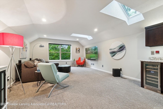 3901 W Howe Rd, Dewitt, MI 48820 - living room featuring beverage cooler, a skylight, vaulted ceiling, light carpet, and recessed lighting