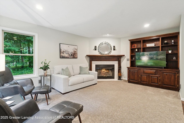 3901 W Howe Rd, Dewitt, MI 48820 - living area with light carpet, a fireplace with flush hearth, and recessed lighting