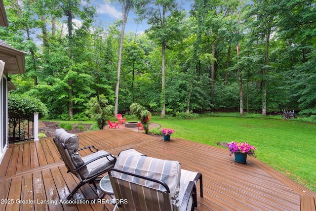 3901 W Howe Rd, Dewitt, MI 48820 - wooden deck with a fire pit and a lawn
