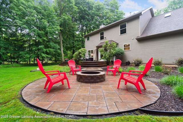 3901 W Howe Rd, Dewitt, MI 48820 - view of patio / terrace featuring a fire pit