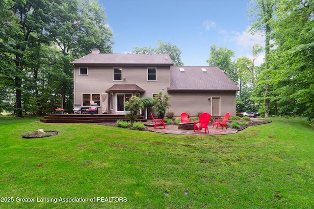 3901 W Howe Rd, Dewitt, MI 48820 - rear view of house with a fire pit, a chimney, a wooden deck, a patio, and a yard