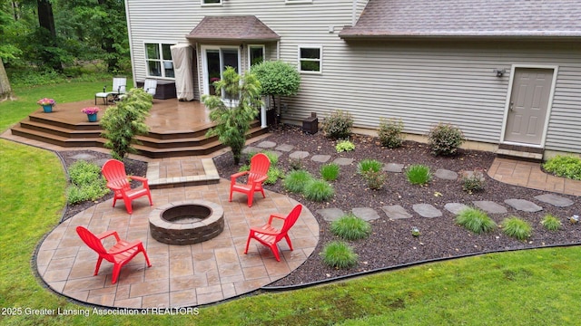 3901 W Howe Rd, Dewitt, MI 48820 - view of patio with an outdoor fire pit and a deck