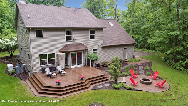 3901 W Howe Rd, Dewitt, MI 48820 - rear view of property featuring a fire pit, a shingled roof, a chimney, and a yard