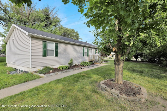 1015 Lake Lansing Rd, Lansing, MI 48906 - view of side of property featuring a lawn