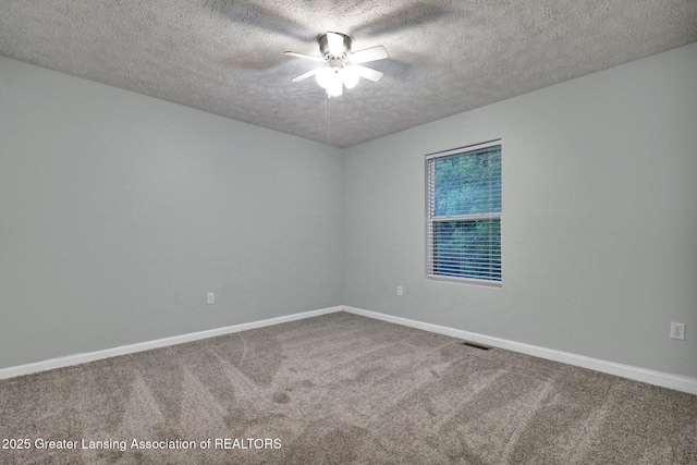 1015 Lake Lansing Rd, Lansing, MI 48906 - empty room featuring a ceiling fan, a textured ceiling, and carpet floors