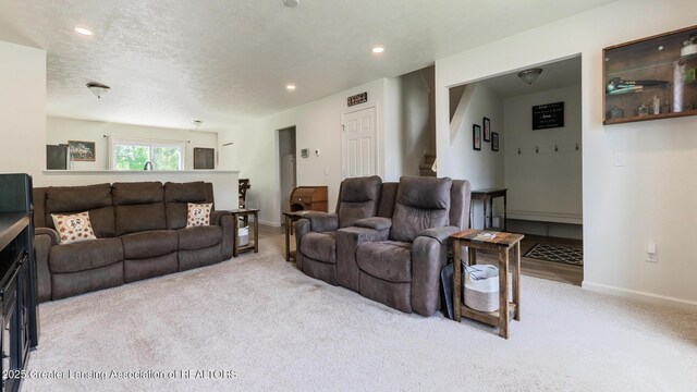 1118 River Oaks Dr, Dewitt, MI 48820 - living area featuring carpet, stairs, recessed lighting, and a textured ceiling