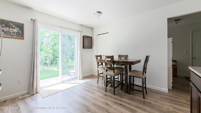 1118 River Oaks Dr, Dewitt, MI 48820 - dining space with light wood finished floors