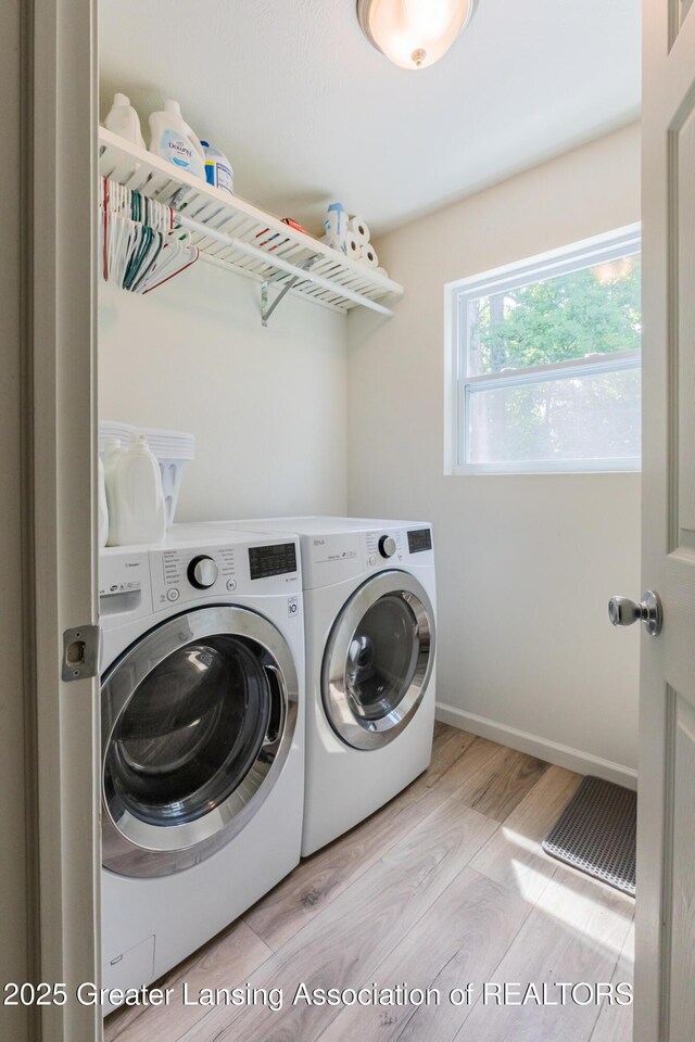 1118 River Oaks Dr, Dewitt, MI 48820 - laundry area with independent washer and dryer and wood finished floors
