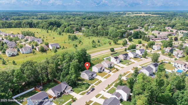 1118 River Oaks Dr, Dewitt, MI 48820 - aerial overview of property's location featuring nearby suburban area and a forest