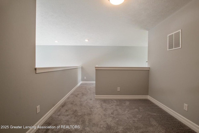 616 Magenta Ct, Haslett, MI 48840 - carpeted spare room featuring a textured ceiling and baseboards