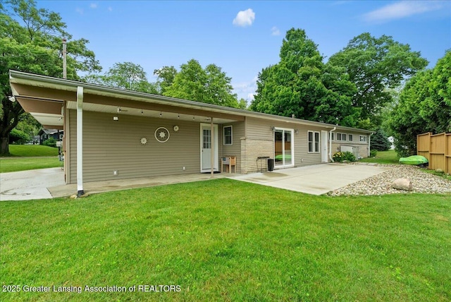 17 Charles E Pl, Battle Creek, MI 49015 - back of house with a yard and a patio area