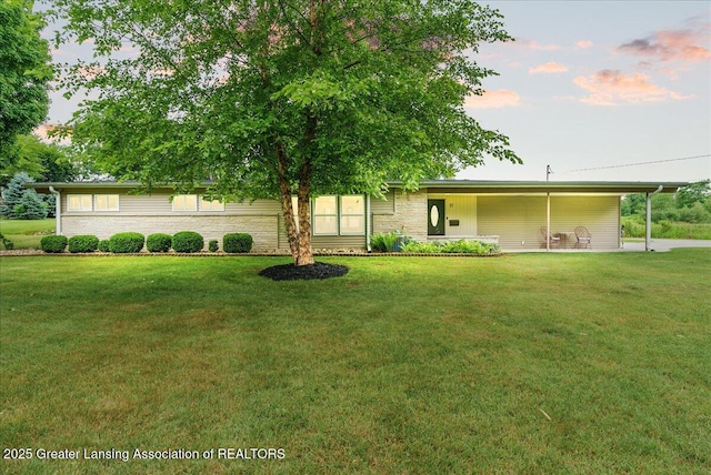 17 Charles E Pl, Battle Creek, MI 49015 - view of front facade featuring a yard