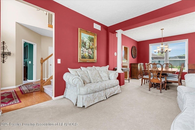 10889 Pointe W Blvd, Grand Ledge, MI 48837 - carpeted living area with stairway and a chandelier