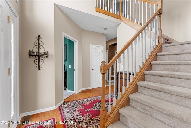 10889 Pointe W Blvd, Grand Ledge, MI 48837 - foyer entrance with stairs and wood finished floors